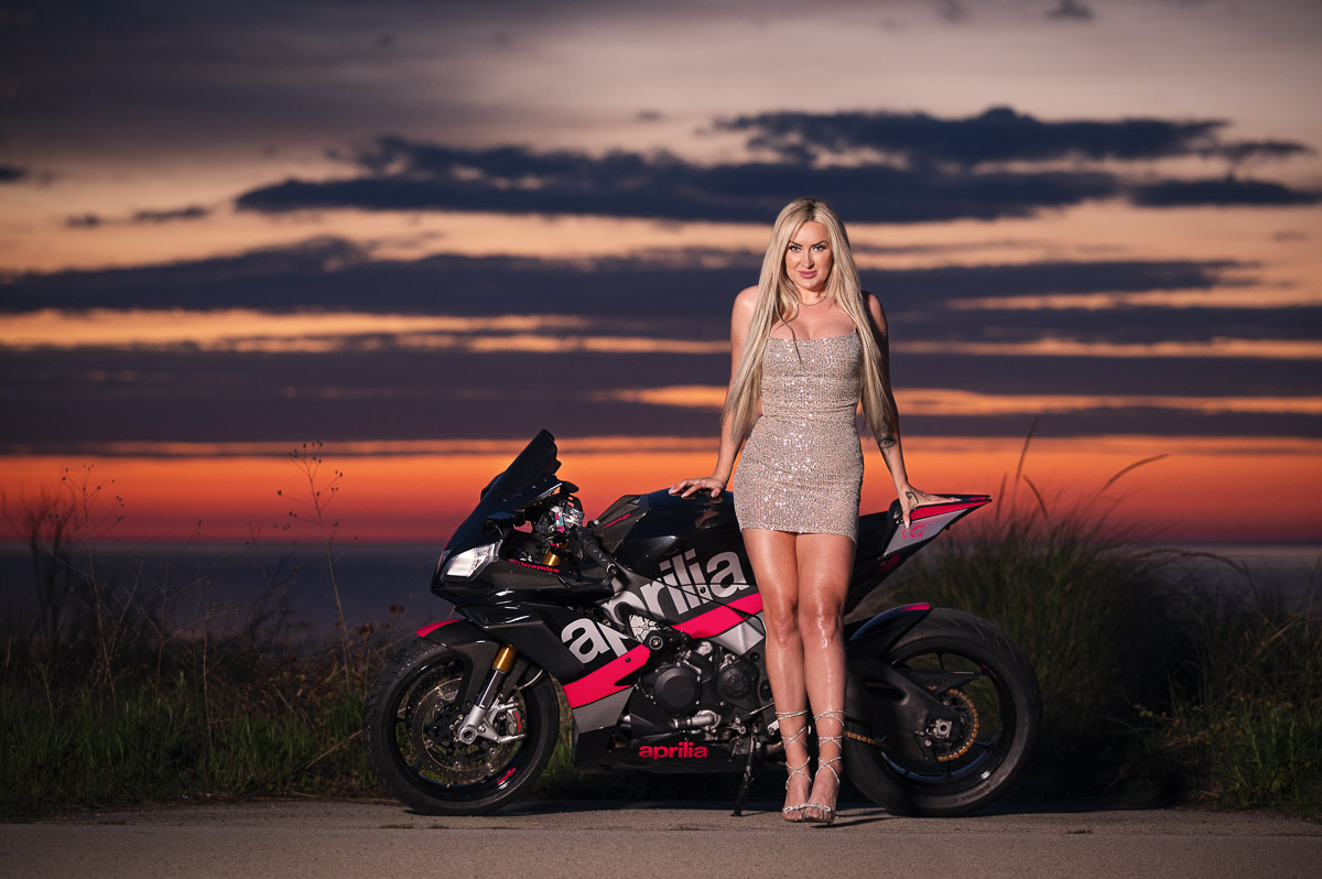 Female with Aprilia at sunrise